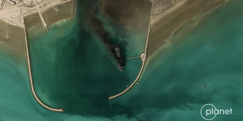 Satellite Imagery Shows Iran's Largest Warship, a Converted Tanker, on Fire